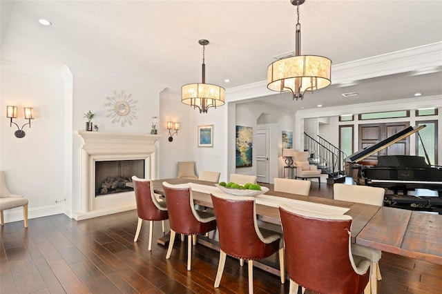 1455 Kelso Blvd, Windermere, FL 34786 - dining space with a chandelier, crown molding, baseboards, stairs, and dark wood-type flooring