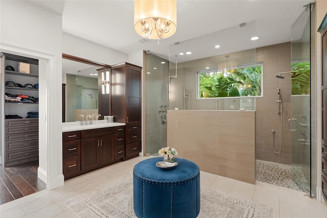 1455 Kelso Blvd, Windermere, FL 34786 - full bathroom with a stall shower, vanity, tile patterned floors, a spacious closet, and recessed lighting