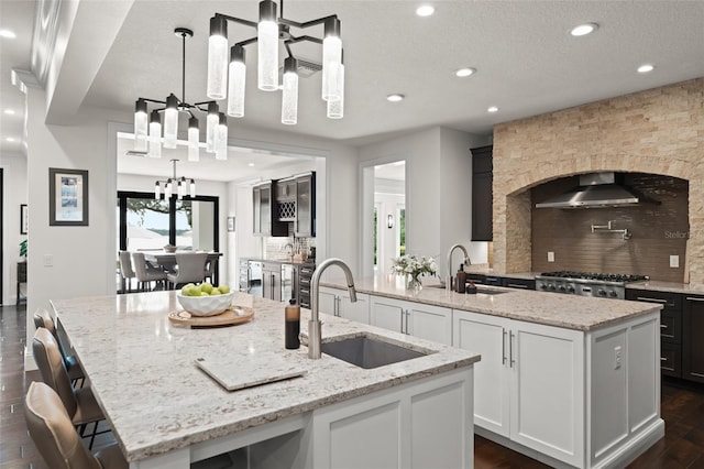 1455 Kelso Blvd, Windermere, FL 34786 - kitchen featuring a large island, a sink, a chandelier, decorative backsplash, and recessed lighting