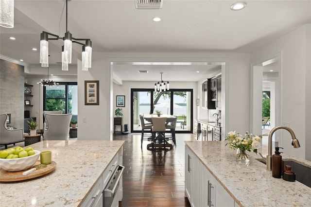 1455 Kelso Blvd, Windermere, FL 34786 - kitchen featuring a chandelier, a sink, dark wood-style flooring, healthy amount of natural light, and recessed lighting