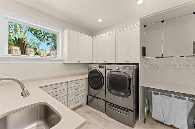 1455 Kelso Blvd, Windermere, FL 34786 - laundry area with washer and dryer, cabinet space, and recessed lighting