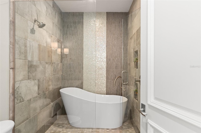 1455 Kelso Blvd, Windermere, FL 34786 - bathroom featuring a freestanding tub, tile walls, and toilet