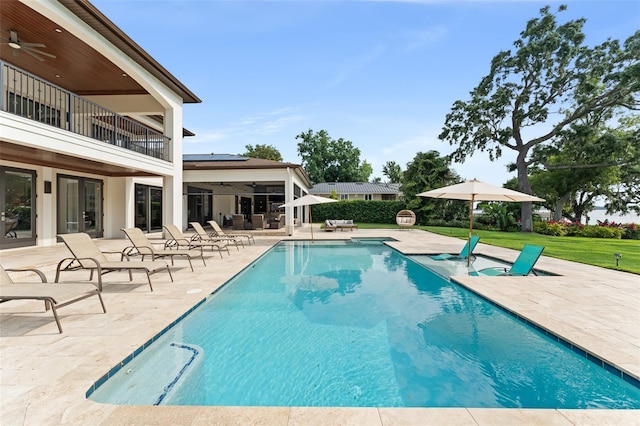 1455 Kelso Blvd, Windermere, FL 34786 - outdoor pool with a ceiling fan, a patio, a yard, and french doors