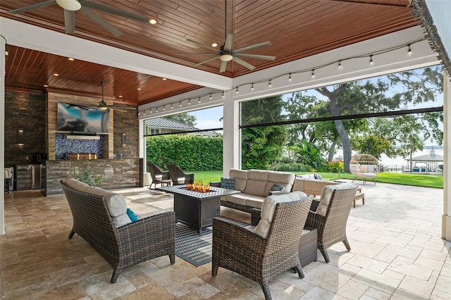 1455 Kelso Blvd, Windermere, FL 34786 - view of patio featuring a ceiling fan, area for grilling, and an outdoor living space with a fire pit