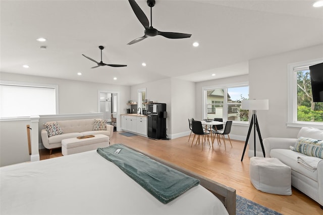1455 Kelso Blvd, Windermere, FL 34786 - bedroom featuring light wood finished floors, recessed lighting, a sink, baseboards, and ceiling fan