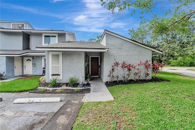 701 Saint Michael Ln, Altamonte Springs, FL 32714 - view of front of home featuring a front yard and stucco siding