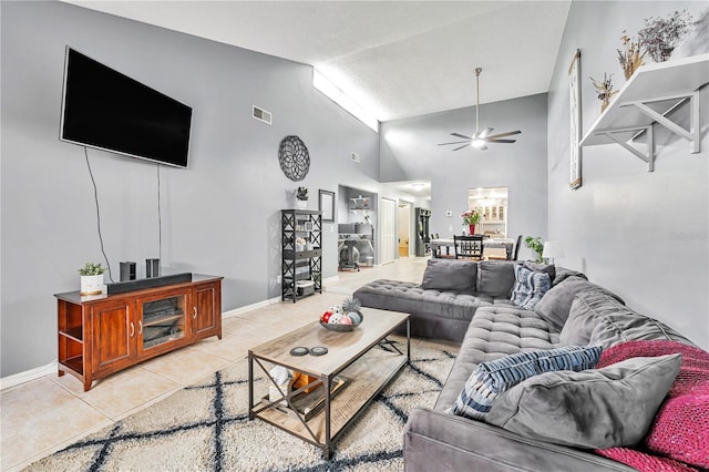 701 Saint Michael Ln, Altamonte Springs, FL 32714 - living area featuring ceiling fan, high vaulted ceiling, light tile patterned floors, and baseboards