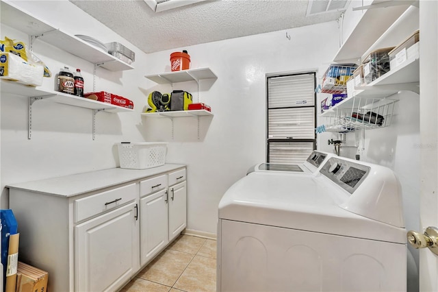701 Saint Michael Ln, Altamonte Springs, FL 32714 - laundry area featuring separate washer and dryer, light tile patterned floors, and a textured ceiling