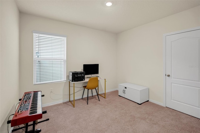 office space featuring carpet flooring and baseboards