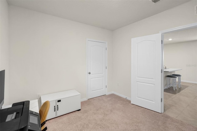 office featuring baseboards, light carpet, and recessed lighting