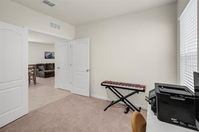 carpeted office with baseboards
