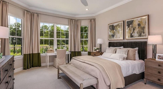 5658 Nevis Ter, Kissimmee, FL 34758 - bedroom featuring light colored carpet, ornamental molding, baseboards, and a ceiling fan
