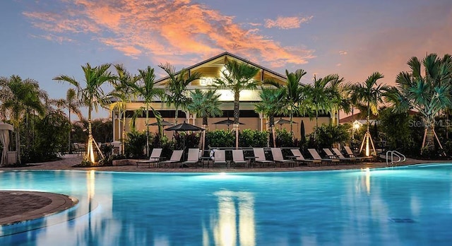 5658 Nevis Ter, Kissimmee, FL 34758 - pool at dusk with a community pool