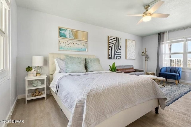 935 S Atlantic Ave Unit 355, Daytona Beach, FL 32118 - bedroom with wood finished floors, baseboards, and a ceiling fan