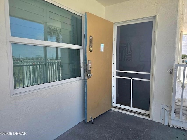 935 S Atlantic Ave Unit 355, Daytona Beach, FL 32118 - view of exterior entry featuring stucco siding