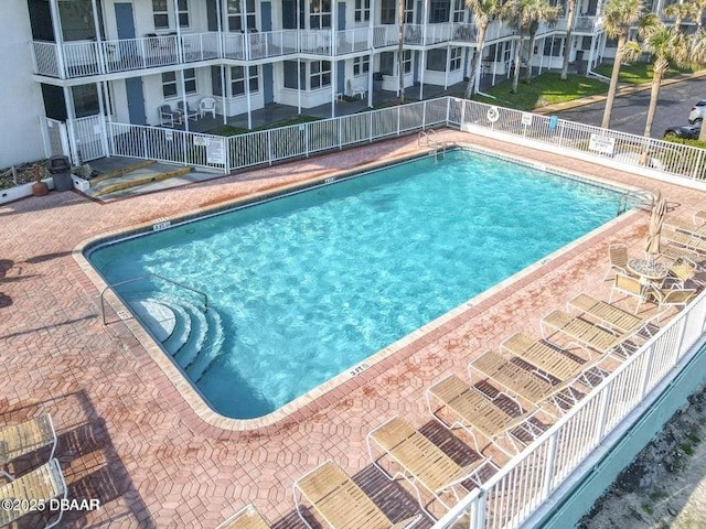 935 S Atlantic Ave Unit 355, Daytona Beach, FL 32118 - community pool with fence and a patio area