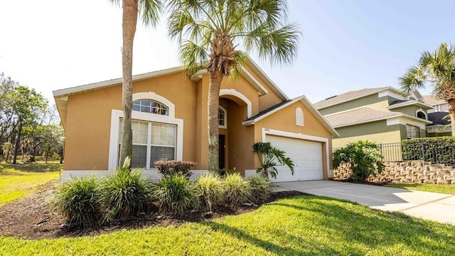 2805 Lido Key Ct, Kissimmee, FL 34747 - mediterranean / spanish house featuring concrete driveway, an attached garage, stucco siding, and fence