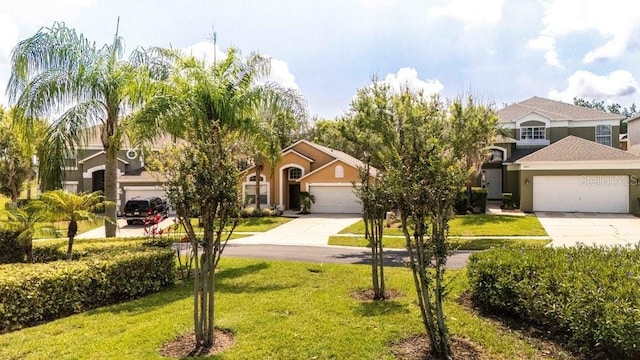 2805 Lido Key Ct, Kissimmee, FL 34747 - view of front of house with driveway, a front lawn, stucco siding, and an attached garage