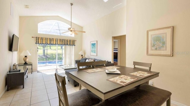 2805 Lido Key Ct, Kissimmee, FL 34747 - dining space featuring high vaulted ceiling, light tile patterned floors, a ceiling fan, and baseboards