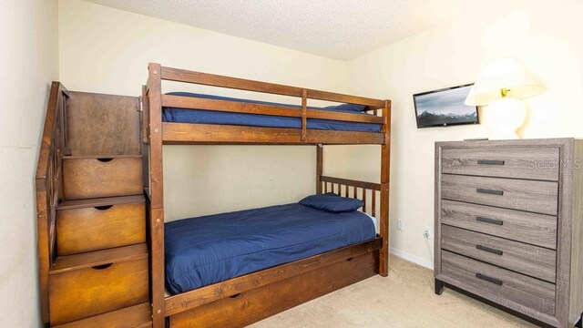2805 Lido Key Ct, Kissimmee, FL 34747 - carpeted bedroom with a textured ceiling