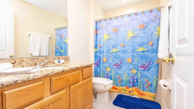 2805 Lido Key Ct, Kissimmee, FL 34747 - bathroom with tile patterned flooring, toilet, vanity, and a shower with curtain