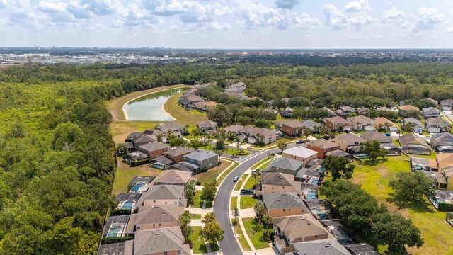 2805 Lido Key Ct, Kissimmee, FL 34747 - aerial overview of property's location featuring nearby suburban area, a large body of water, and a heavily wooded area