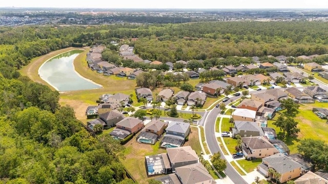 2805 Lido Key Ct, Kissimmee, FL 34747 - aerial view of property and surrounding area featuring nearby suburban area, a forest, and a large body of water