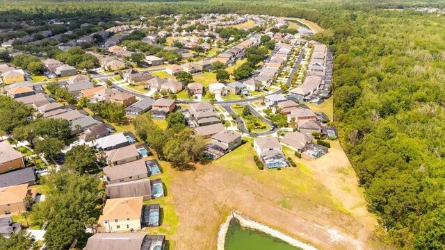 2805 Lido Key Ct, Kissimmee, FL 34747 - aerial view of property's location featuring nearby suburban area, a heavily wooded area, and a large body of water