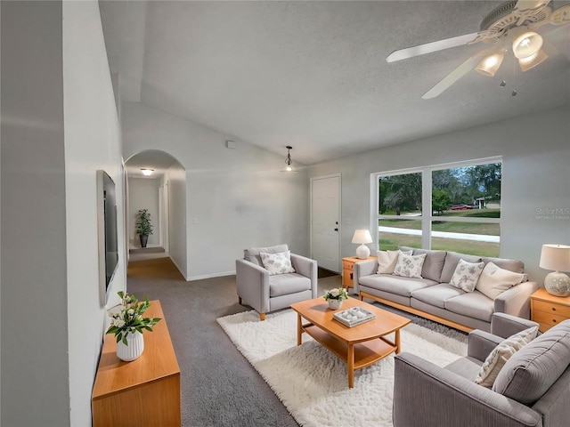 3090 Yorkshire Dr, Deltona, FL 32738 - living area featuring arched walkways, a ceiling fan, vaulted ceiling, carpet, and baseboards