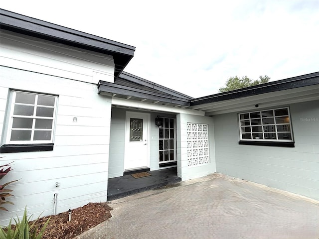 6615 Beamer Way, Orlando, FL 32807 - property entrance with a patio and concrete block siding