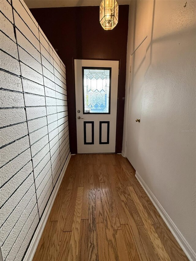 6615 Beamer Way, Orlando, FL 32807 - doorway to outside featuring wood finished floors and baseboards