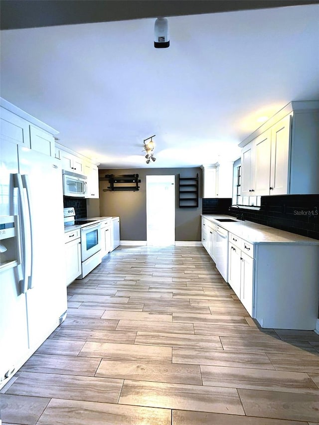 6615 Beamer Way, Orlando, FL 32807 - kitchen with white range with electric stovetop, refrigerator with ice dispenser, stainless steel microwave, dishwashing machine, and a sink