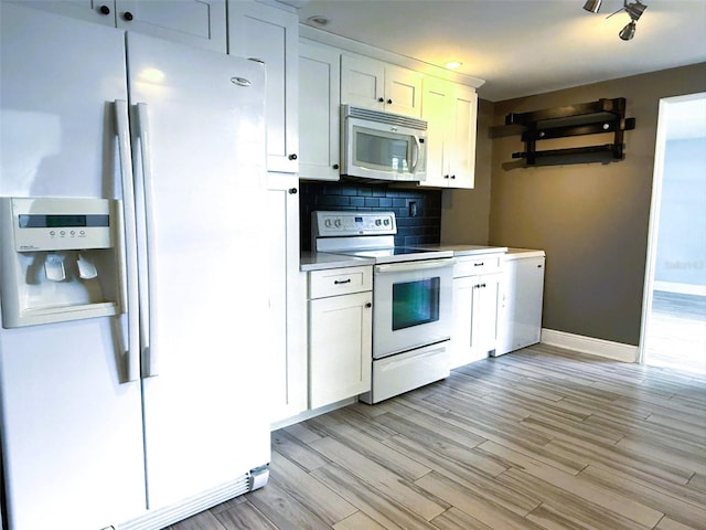 6615 Beamer Way, Orlando, FL 32807 - kitchen with white appliances, white cabinets, light wood finished floors, baseboards, and recessed lighting