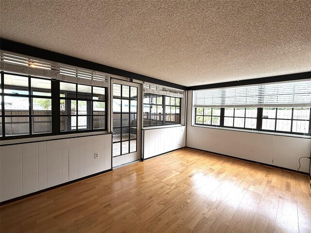 6615 Beamer Way, Orlando, FL 32807 - unfurnished room with wood finished floors and a textured ceiling