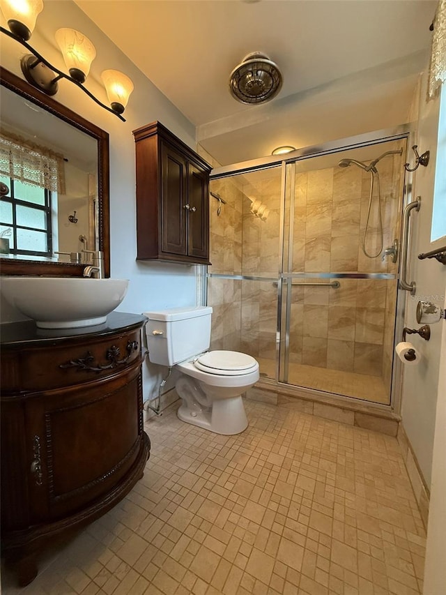 6615 Beamer Way, Orlando, FL 32807 - full bathroom with a stall shower, toilet, and vanity