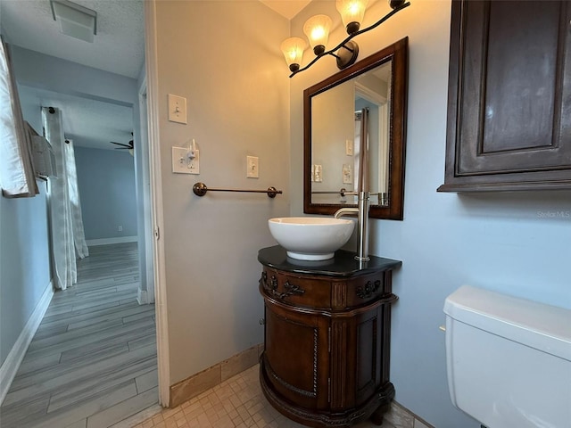 6615 Beamer Way, Orlando, FL 32807 - bathroom with baseboards, vanity, and toilet