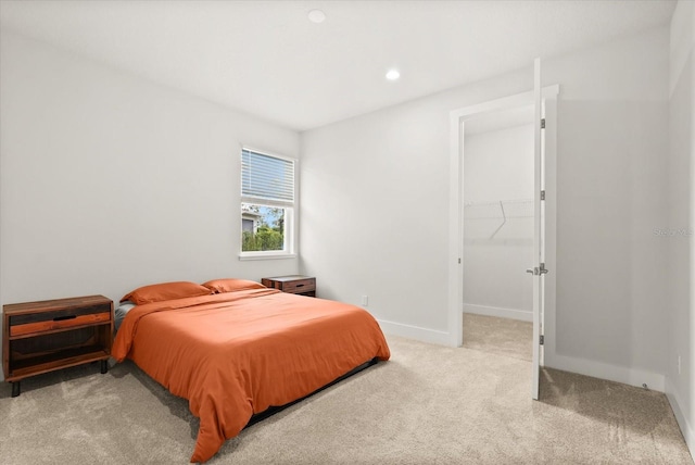 3635 Arbordale Loop, Sanford, FL 32771 - bedroom with carpet flooring, baseboards, a walk in closet, and recessed lighting