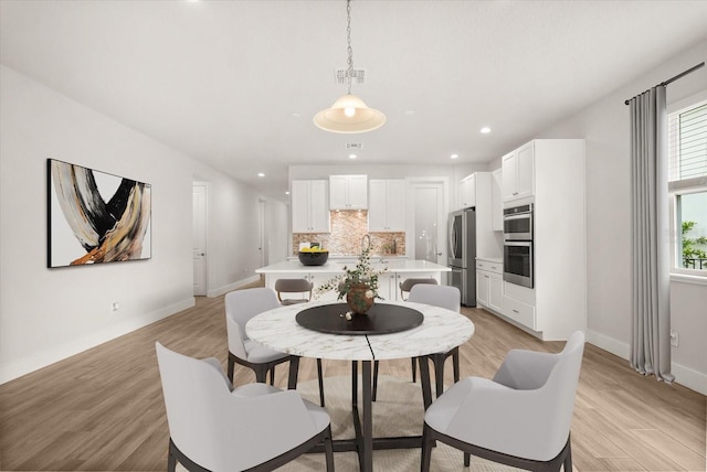 3635 Arbordale Loop, Sanford, FL 32771 - dining room with baseboards, light wood finished floors, and recessed lighting