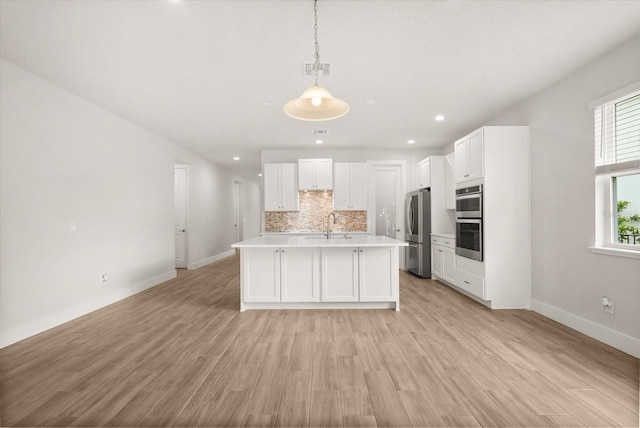 3635 Arbordale Loop, Sanford, FL 32771 - kitchen featuring stainless steel appliances, light countertops, decorative backsplash, baseboards, and white cabinetry