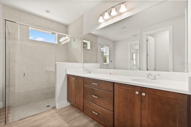 3635 Arbordale Loop, Sanford, FL 32771 - full bath featuring double vanity, a stall shower, and wood finished floors