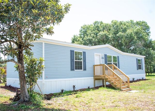 3790 NW 4th Ave, Okeechobee, FL 34972 - manufactured / mobile home with a front lawn