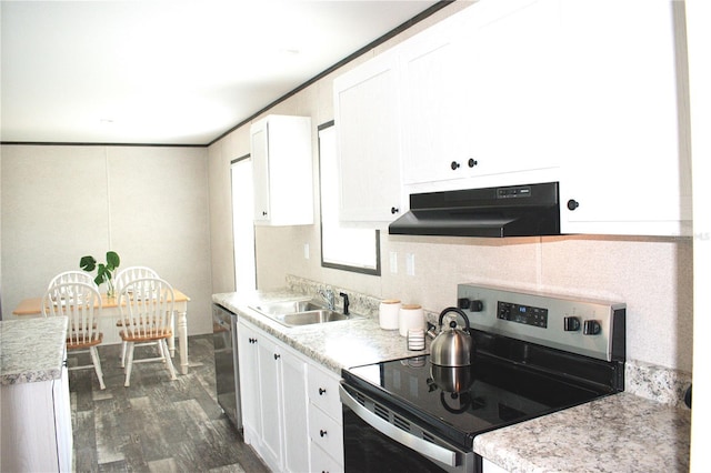 3790 NW 4th Ave, Okeechobee, FL 34972 - kitchen featuring stainless steel appliances, under cabinet range hood, a sink, white cabinets, and light countertops