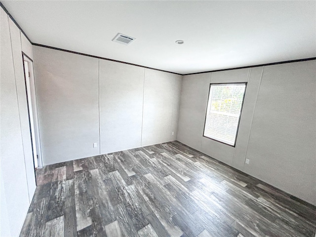 3790 NW 4th Ave, Okeechobee, FL 34972 - unfurnished room with wood finished floors and crown molding