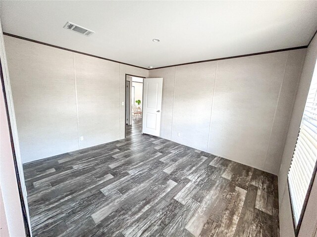 3790 NW 4th Ave, Okeechobee, FL 34972 - spare room featuring wood finished floors and ornamental molding