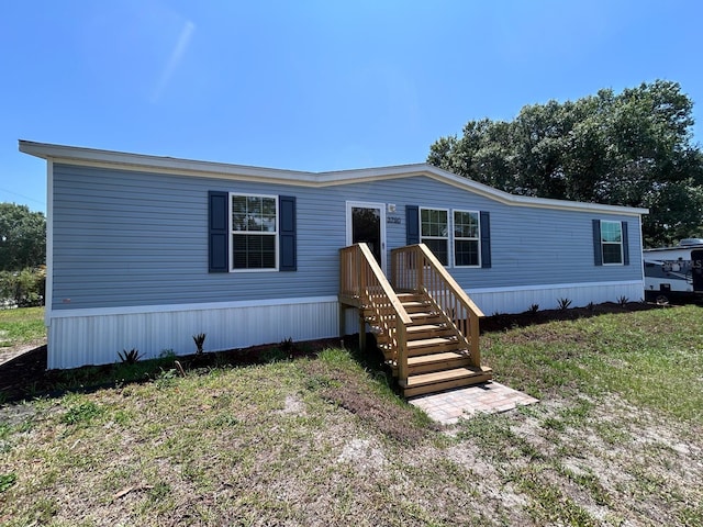 3790 NW 4th Ave, Okeechobee, FL 34972 - manufactured / mobile home featuring a front yard