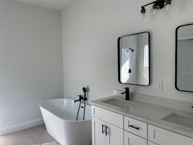 5153 SW 159th St, Ocala, FL 34473 - full bath with a freestanding bath, double vanity, and baseboards