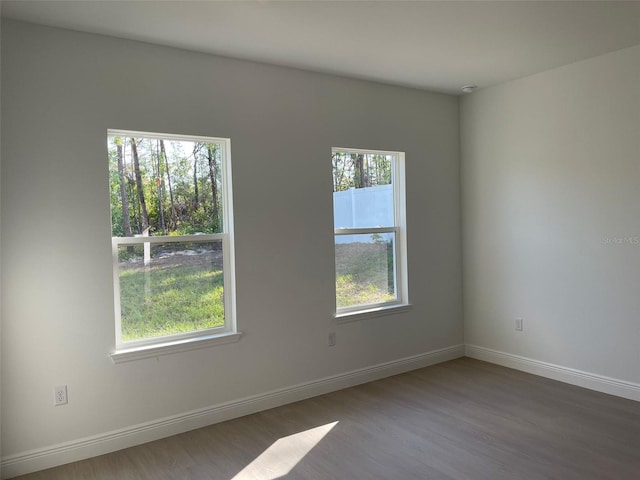 5153 SW 159th St, Ocala, FL 34473 - empty room featuring wood finished floors and baseboards