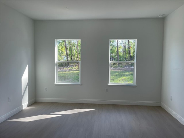 5153 SW 159th St, Ocala, FL 34473 - empty room with wood finished floors and baseboards