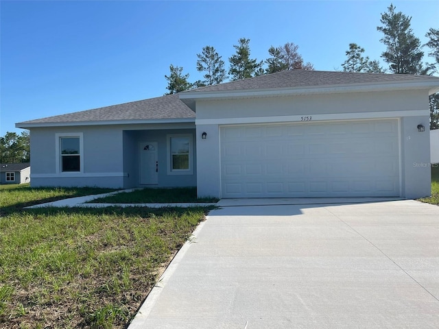 5153 SW 159th St, Ocala, FL 34473 - ranch-style house with stucco siding, concrete driveway, an attached garage, a front yard, and roof with shingles