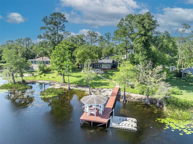 277 Sunrise Pt, Lake Mary, FL 32746 - dock area featuring view of scattered trees, a water view, and a lawn